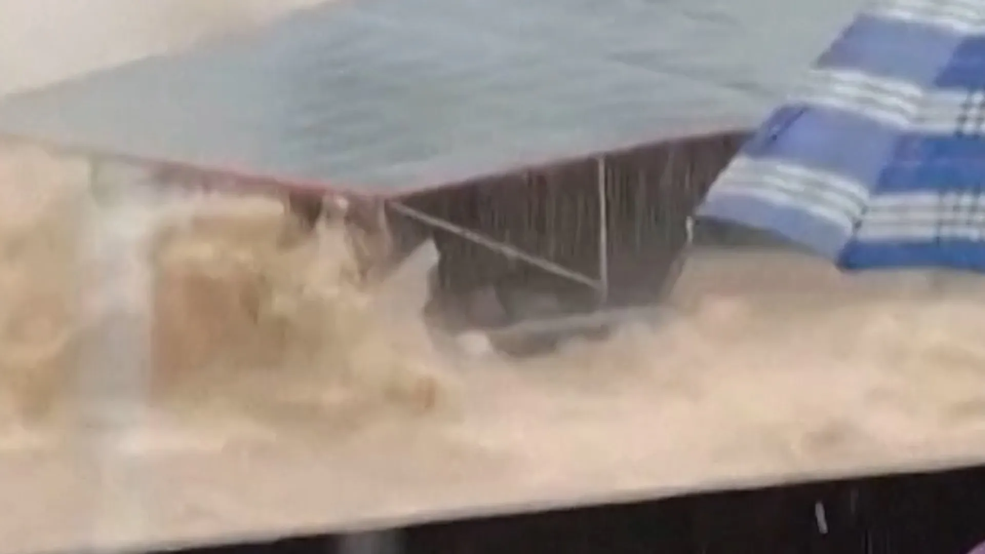 Moment three-storey building collapses amid flooding in China