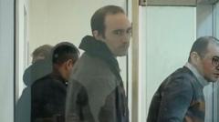 Azerbaijan pardons Frenchman after EU lifts sanctions on Russian billionaire