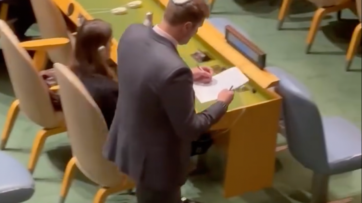 Israeli official takes notes after UN walkout against Netanyahu
