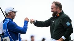 Inspired Lowry takes four-shot lead into final day