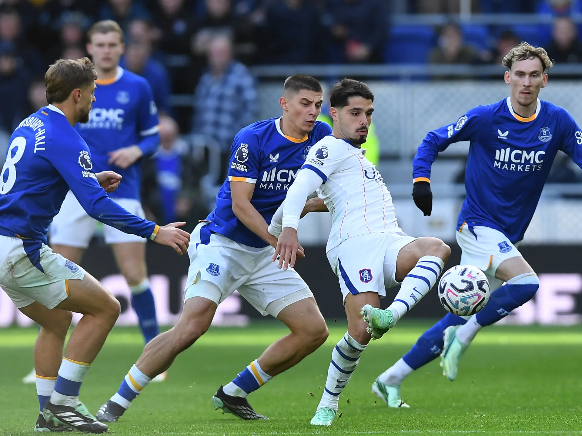 Neto’s brace fires Chelsea past Everton but Martinez head injury mars win