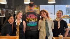 Harry Styles funds free coffee at two London cafes