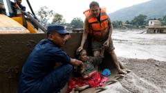 People pulled from mud in Nepal after deadly flash floods