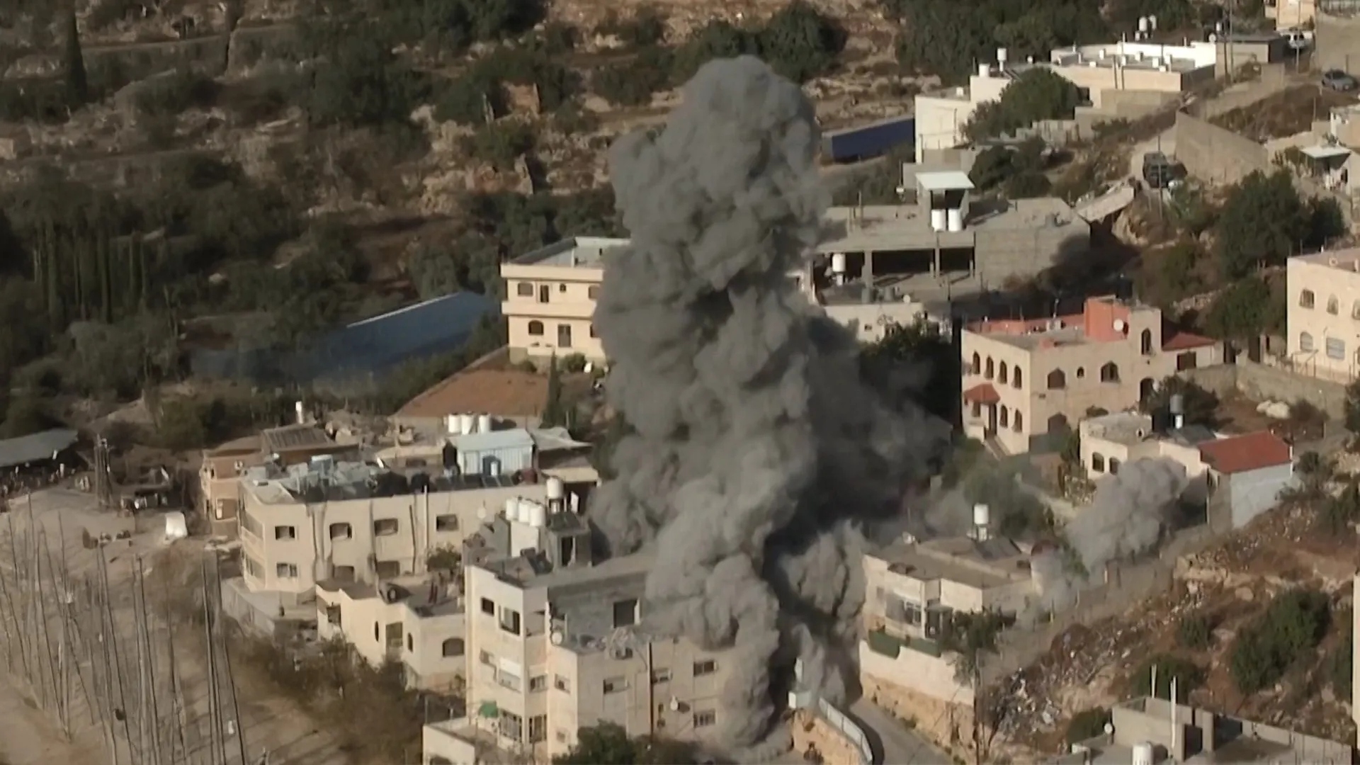 Israeli forces blow up homes of Palestinians accused of killing soldiers