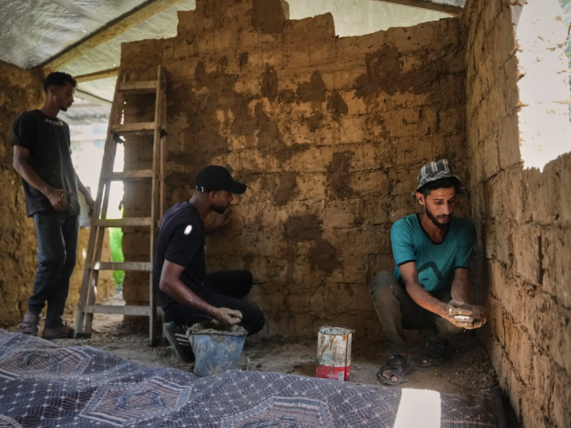 Photos: Palestinians rebuild Gaza’s ruins with mud bricks, scrap
